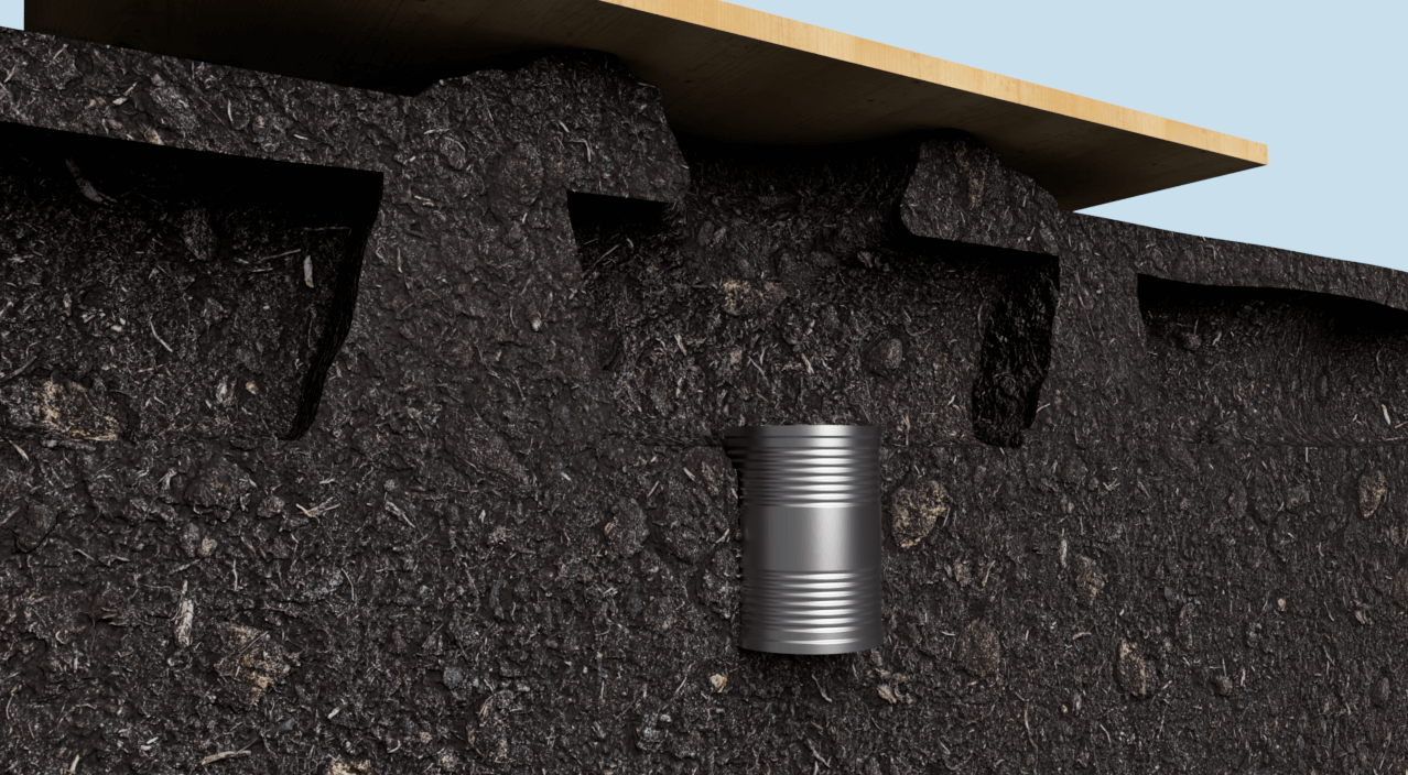 Homemade mole trap using a can buried in the ground